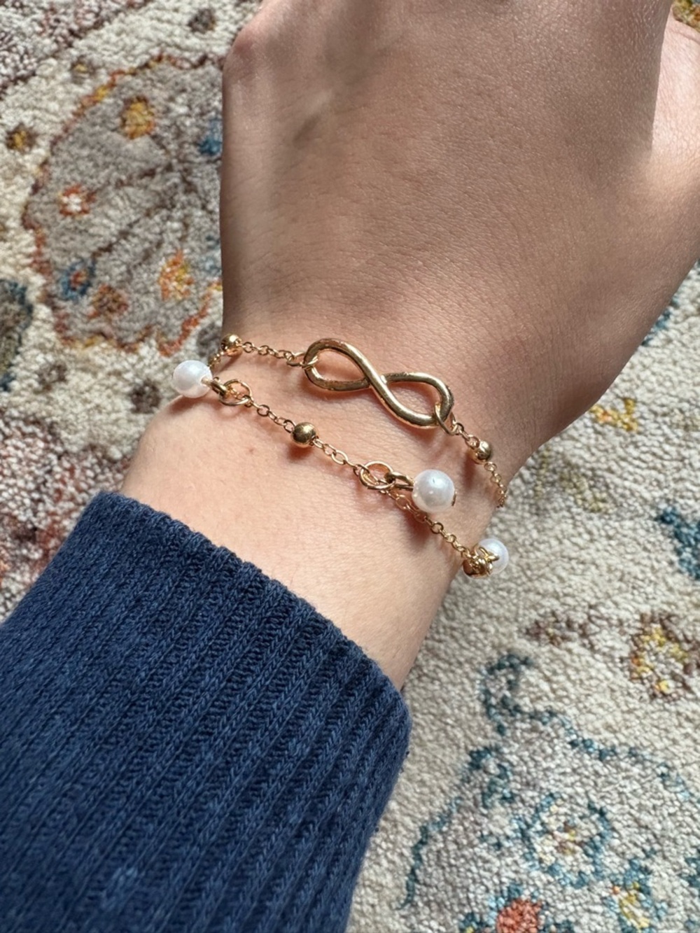 Gold Colored Chain Bracelets with Butterfly, Pearl, and an Infinity Sign Detail